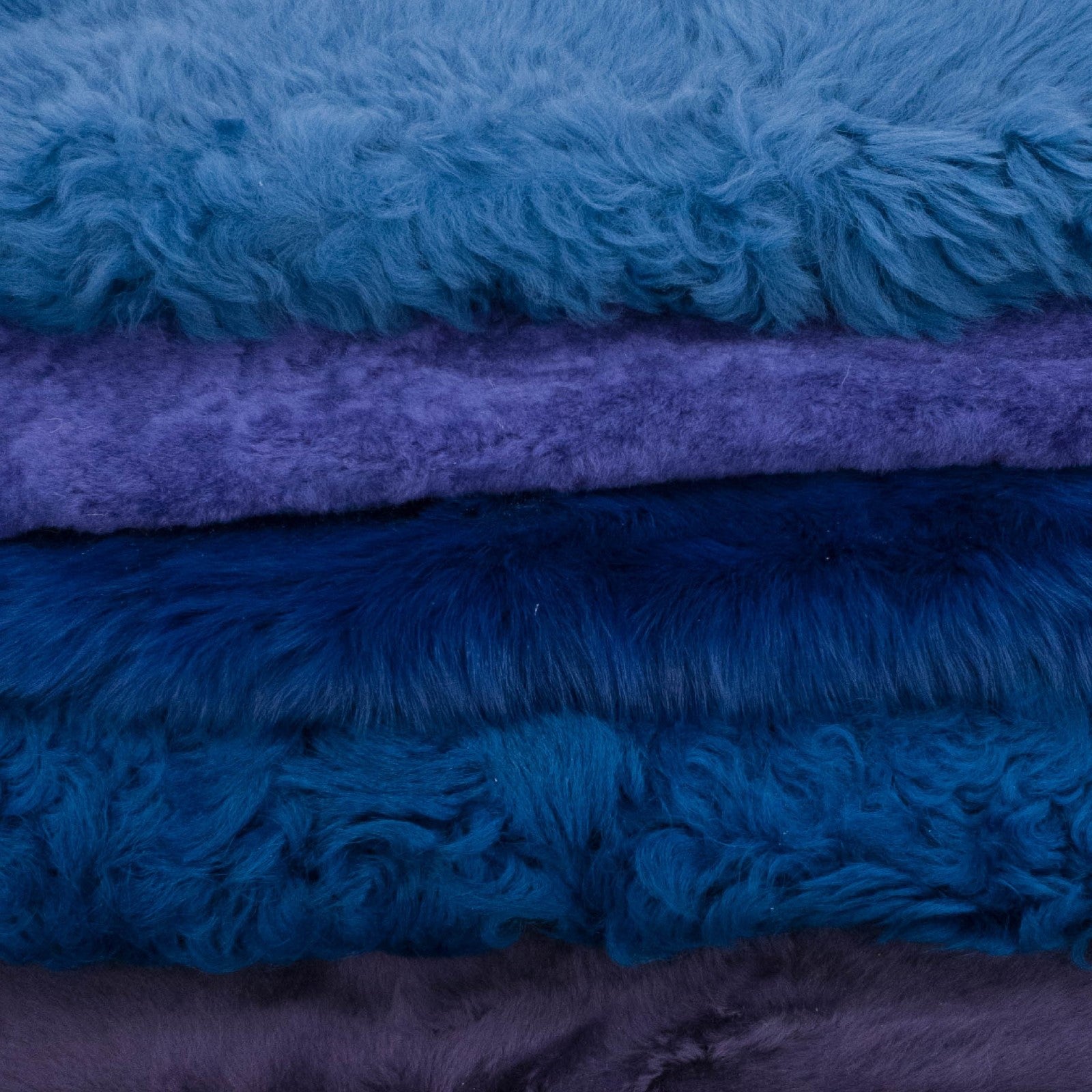 Blue Mix, 1-3+ Sq Ft, Sheepskin Shearling Hides, 2-3+ / Bright Blue / Curly/Shaved | The Leather Guy